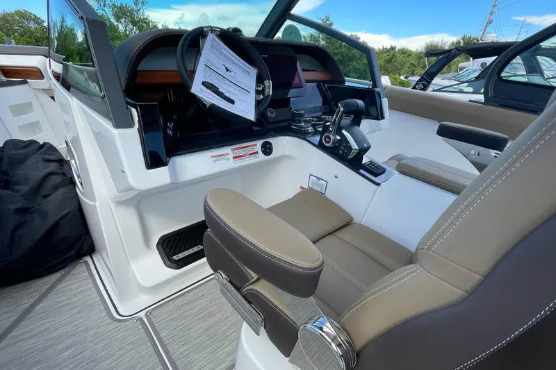 Slide: The Image of 2026 Monterey 30 ELITE boat cockpit with modern controls and comfortable seating. - 10