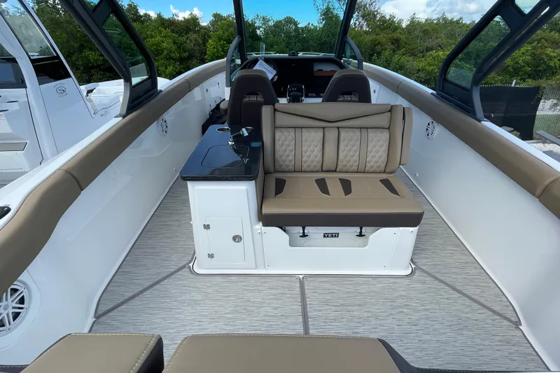 Slide: The Image of 2026 Monterey 30 ELITE boat interior with tan seating and sleek design. - 20