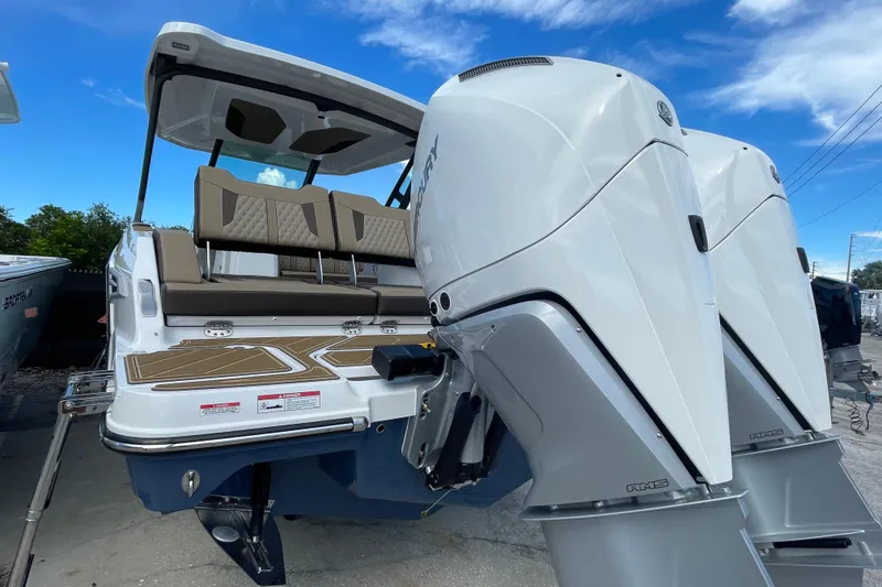 Slide: The Image of 2026 Monterey 30 ELITE boat with dual outboard engines, sleek design, and spacious seating. - 21