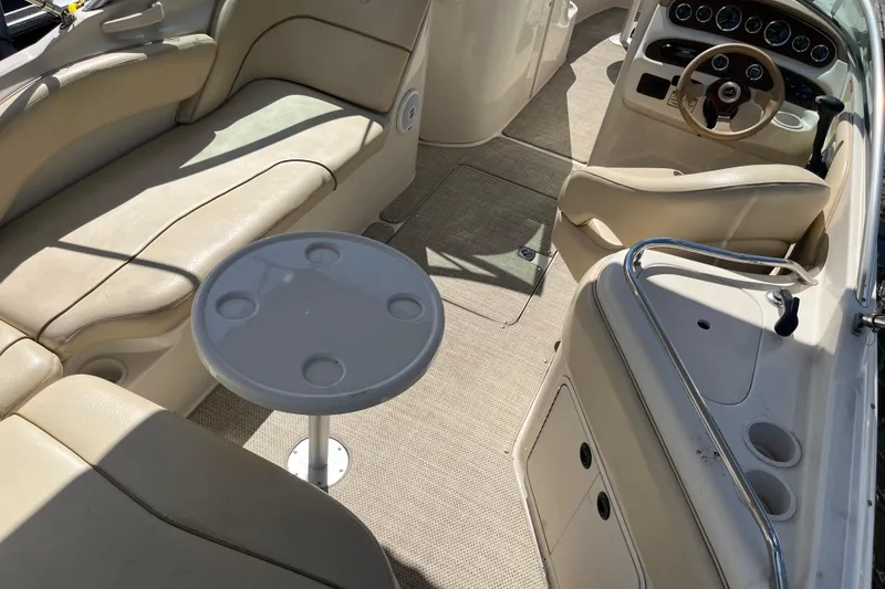 Slide: The Image of Interior of 2001 Sea Ray 240 Sundancer boat with seating and steering wheel. - 3