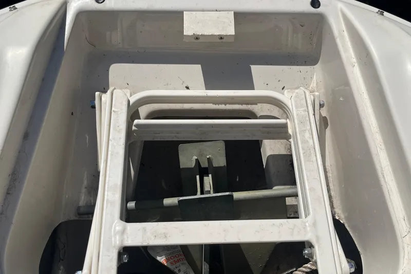 Slide: The Image of 2001 Sea Ray 240 Sundancer anchor storage compartment with ladder. - 30