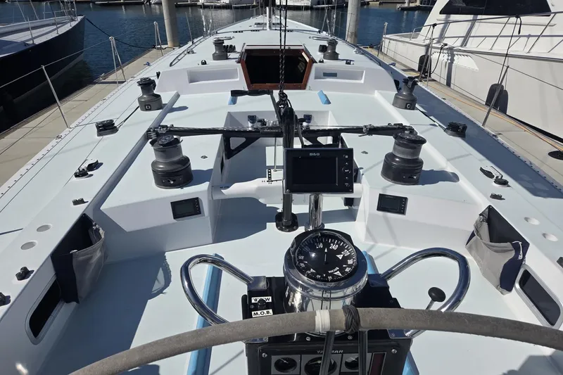 Slide: The Image of Cockpit view of a 1986 Santa Cruz 70 sailboat, featuring navigation instruments and winches. - 20