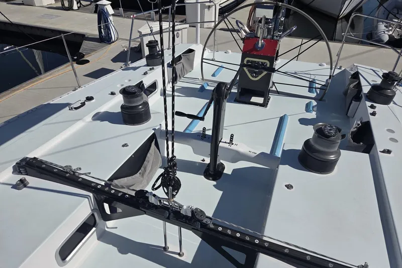 Slide: The Image of Deck view of 1986 Santa Cruz 70 sailboat with winches and steering wheel. - 21