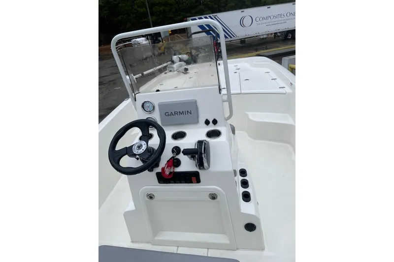 Slide: The Image of 2024 Mako Pro Skiff 19 CC boat console with Garmin navigation system. - 2