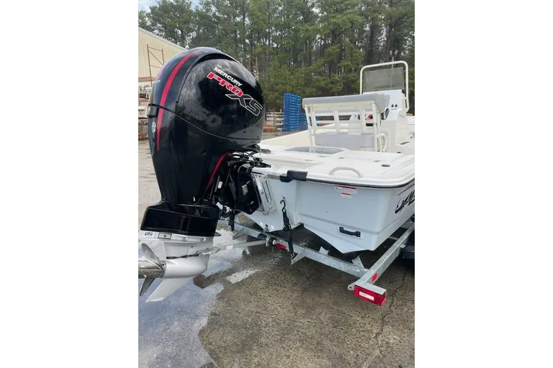 Slide: The Image of 2024 Mako Pro Skiff 19 CC with Mercury Pro XS engine on trailer. - 8