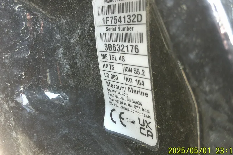 Slide: The Image of Close-up of Mercury Marine engine label on 2024 Mako Pro Skiff 17 CC boat. - 10