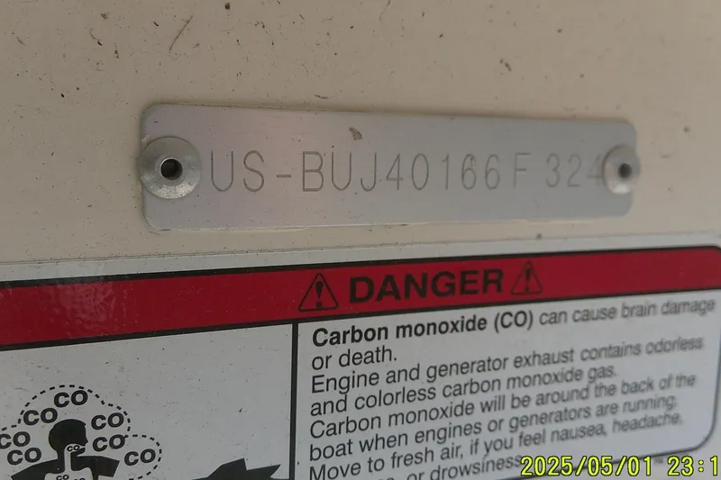 Slide: The Image of 2024 Mako Pro Skiff 17 CC warning label with carbon monoxide danger notice. - 11