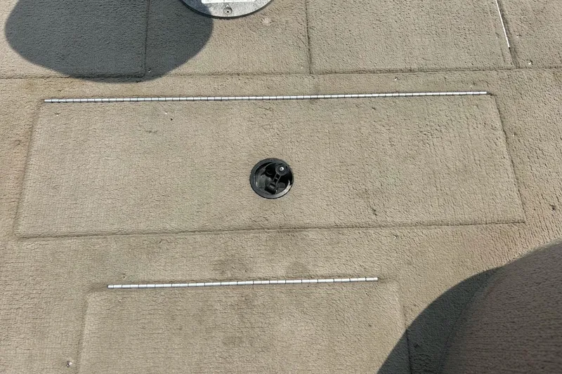 Slide: The Image of Deck of 2003 Crestliner 1850 Fish Hawk SC boat with storage compartment. - 11