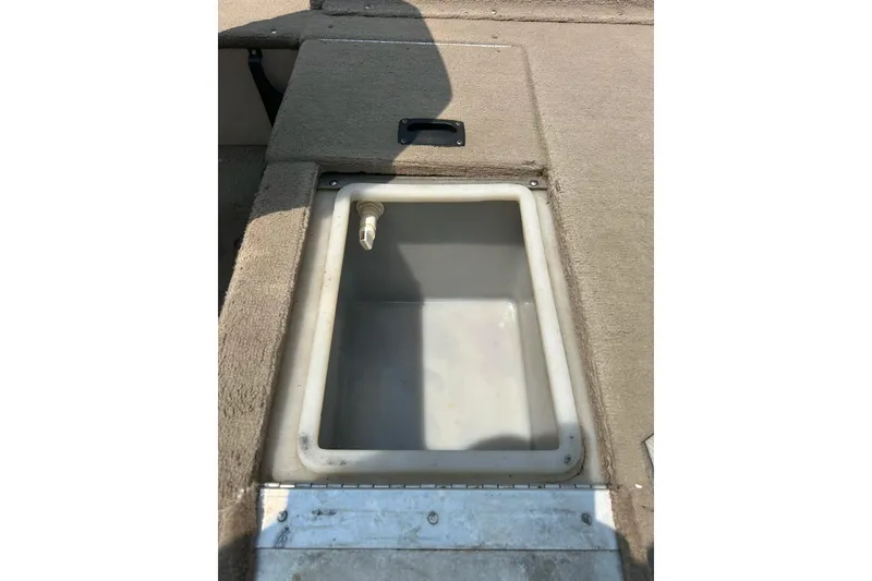 Slide: The Image of Livewell compartment in 2003 Crestliner 1850 Fish Hawk SC boat, open and empty. - 31