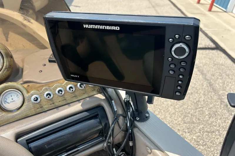 Slide: The Image of Humminbird Helix 9 fish finder on 2003 Crestliner 1850 Fish Hawk SC dashboard. - 34