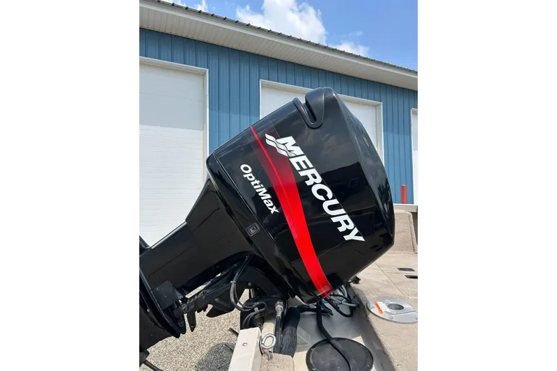 Slide: The Image of Mercury OptiMax engine on 2003 Crestliner 1850 Fish Hawk SC boat, outdoors. - 4