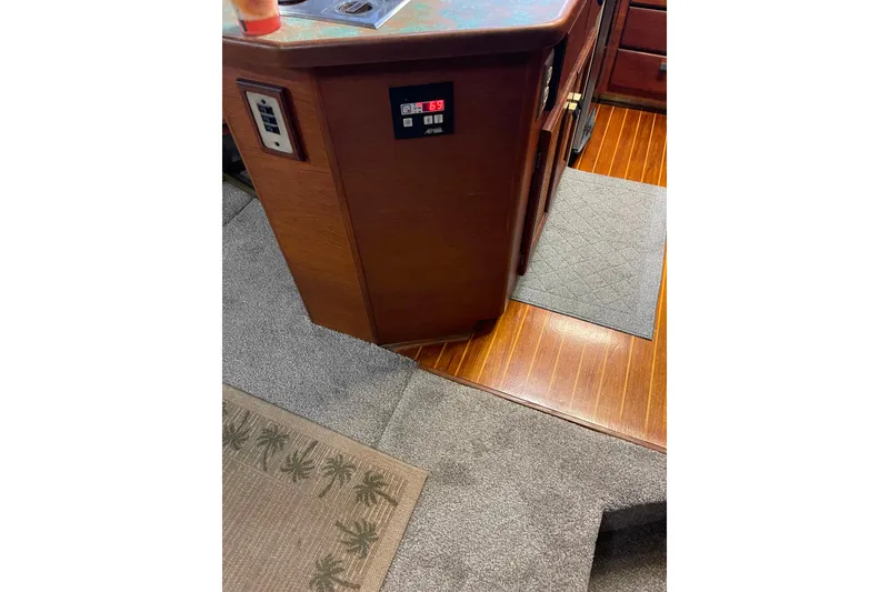 Slide: The Image of 1986 Bayliner 4550 Motoryacht interior with wood flooring and control panel. - 15