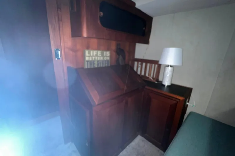 Slide: The Image of Interior of 1986 Bayliner 4550 Motoryacht with wooden cabinetry and lamp. - 29