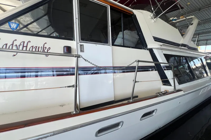 Slide: The Image of 1986 Bayliner 4550 Motoryacht docked in a covered marina. - 3