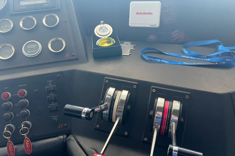 Slide: The Image of Control panel of 1986 Bayliner 4550 Motoryacht with gauges and throttle levers. - 39