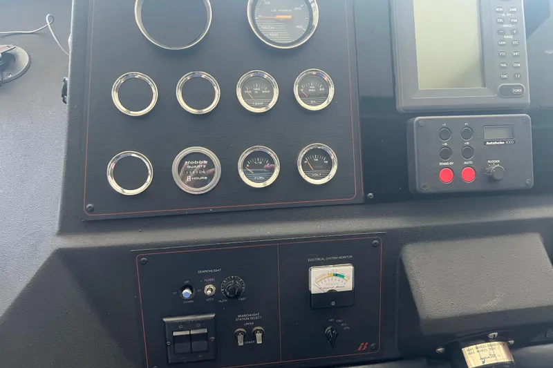 Slide: The Image of Control panel of a 1986 Bayliner 4550 Motoryacht with gauges and navigation equipment. - 41