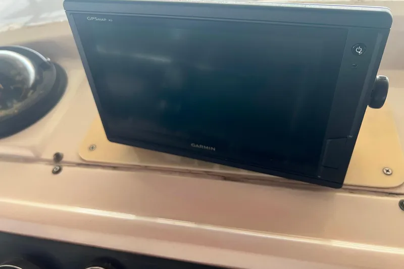 Slide: The Image of Garmin GPS device on 1986 Bayliner 4550 Motoryacht dashboard. - 52