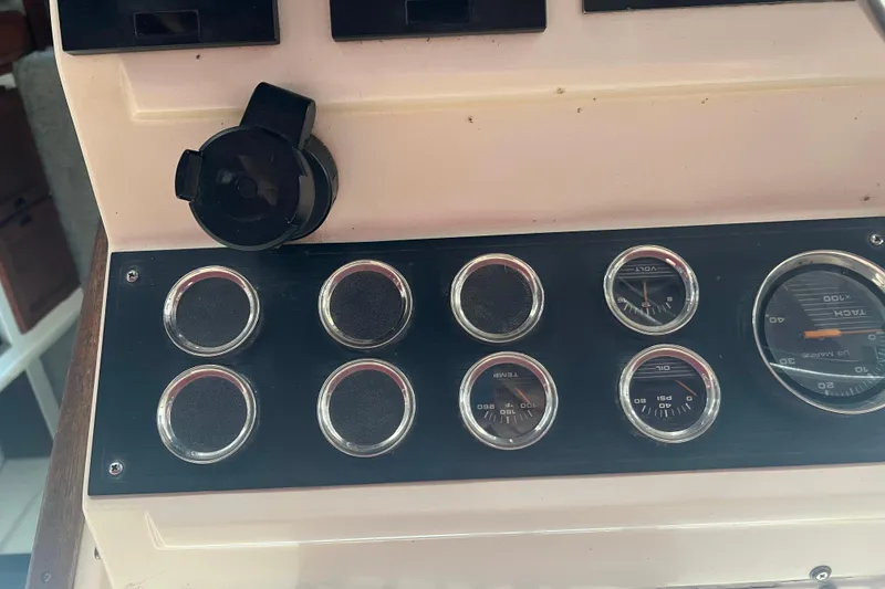Slide: The Image of Dashboard of a 1986 Bayliner 4550 Motoryacht with gauges and controls. - 56