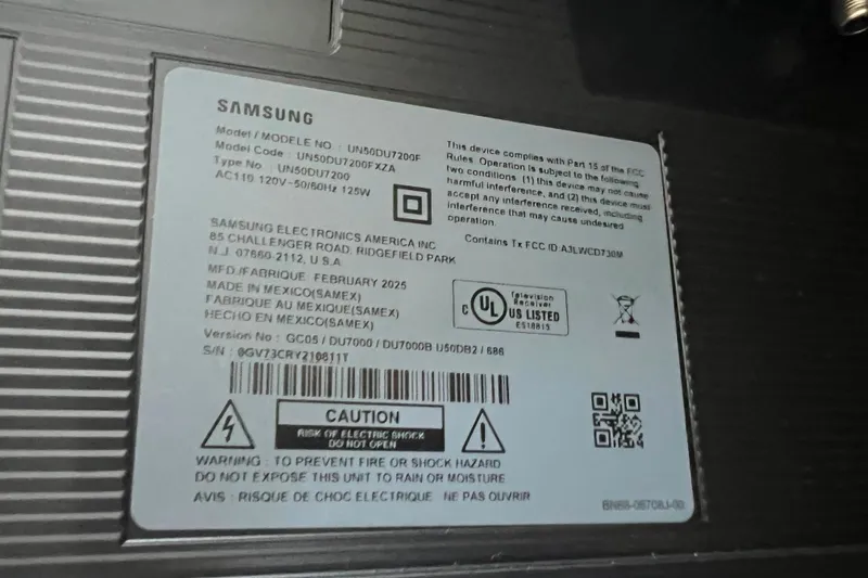 Slide: The Image of Label on Samsung device with model details and safety warnings. Bayliner 4550 Motoryacht, 1986. - 61