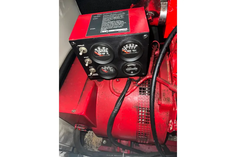 Slide: The Image of Engine control panel of 1986 Bayliner 4550 Motoryacht, featuring gauges and switches. - 69