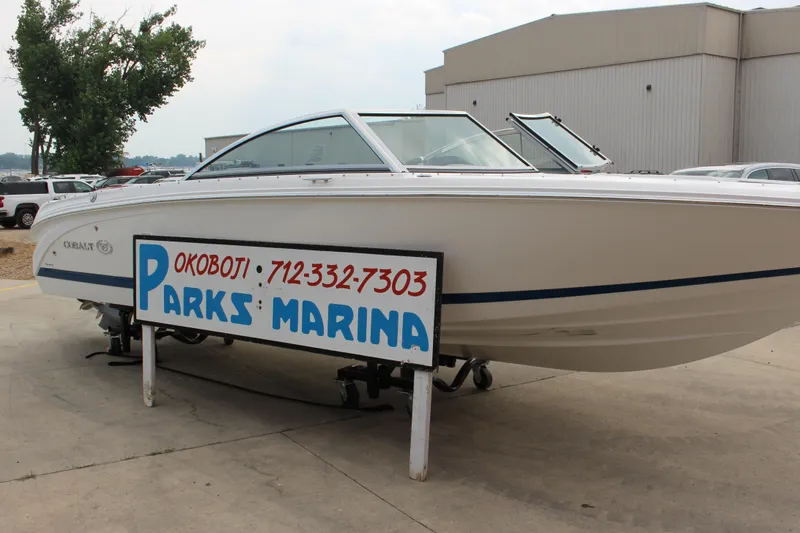 The Image of 2024 Cobalt 220S boat at Parks Marina, Okoboji, displayed outdoors. - 0