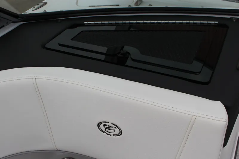 Slide: The Image of 2024 Cobalt 220S boat interior with white seating and sleek dashboard design. - 17