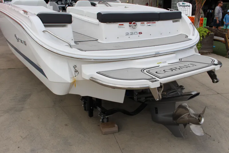 Slide: The Image of 2024 Cobalt 220S boat rear view with propeller and swim platform. - 4