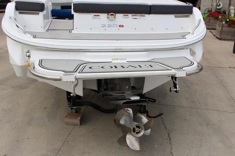 Slide: The Image of 2024 Cobalt 220S boat rear view with propeller and swim platform. - 5