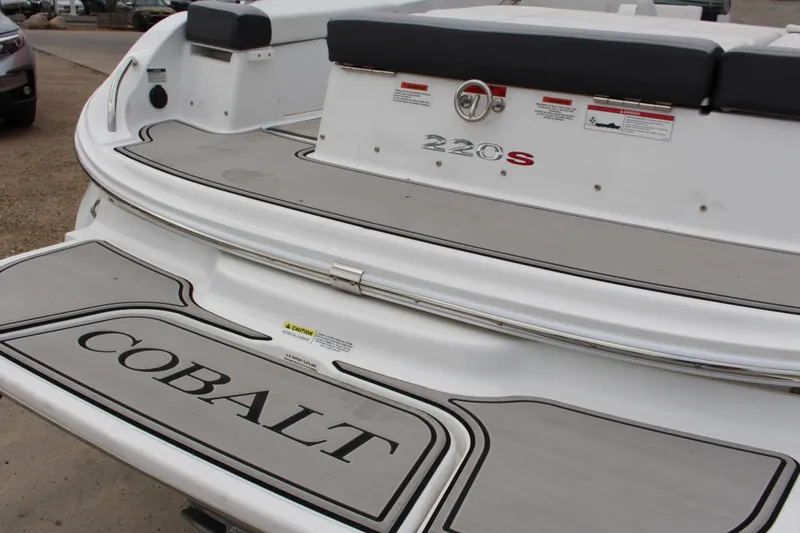 Slide: The Image of 2024 Cobalt 220S boat rear view with logo and model details. - 6