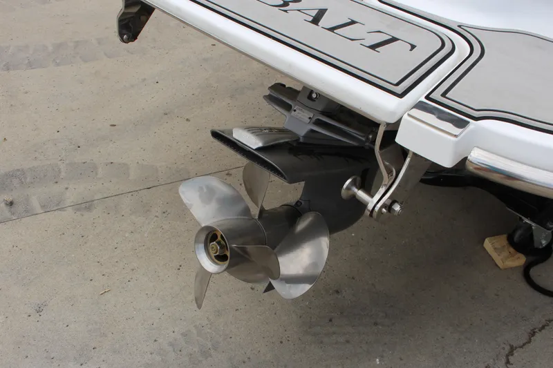 Slide: The Image of 2024 Cobalt 220S boat propeller and stern detail on concrete surface. - 7