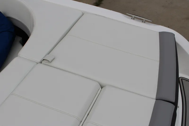 Slide: The Image of 2024 Cobalt 220S boat with white cushioned seating and sleek design. - 8