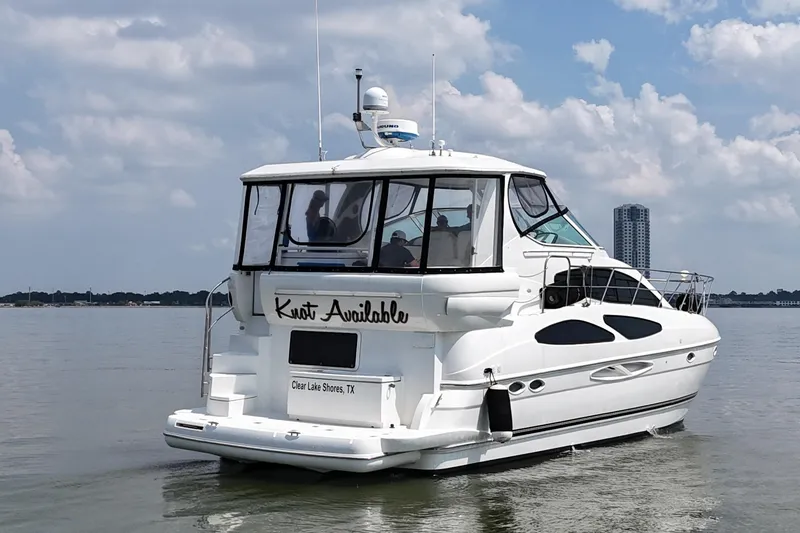 Slide: The Image of 2004 Cruisers Yachts 405 Express Motoryacht on calm water, Clear Lake Shores, TX. - 13