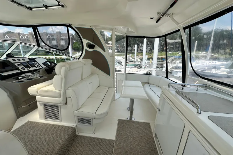 Slide: The Image of Luxurious interior of 2004 Cruisers Yachts 405 Express Motoryacht with plush seating and helm. - 25