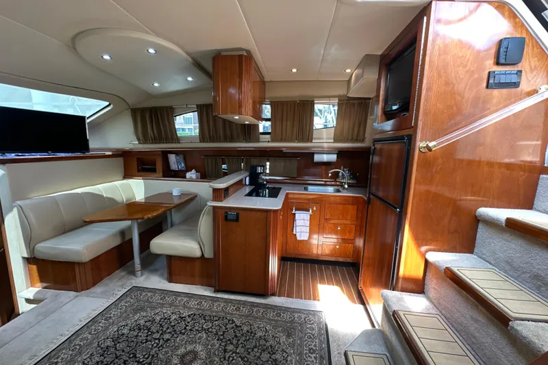 Slide: The Image of Luxurious interior of 2004 Cruisers Yachts 405 Express Motoryacht with kitchen and dining area. - 50
