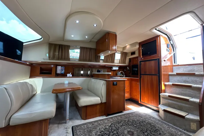 Slide: The Image of Luxurious interior of 2004 Cruisers Yachts 405 Express Motoryacht with dining area and kitchen. - 52