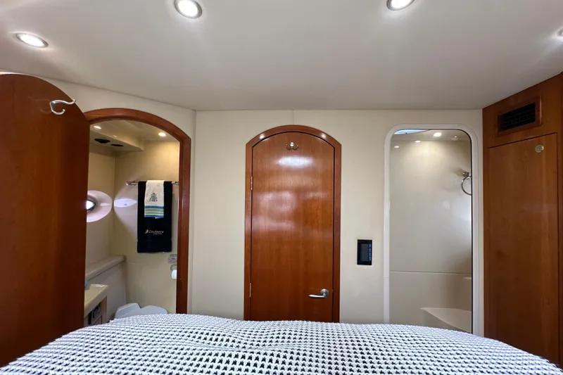 Slide: The Image of 2004 Cruisers Yachts 405 Express Motoryacht interior with wooden doors and modern lighting. - 74