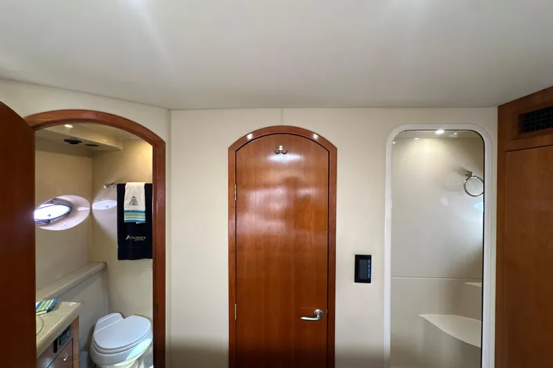 Slide: The Image of Luxurious bathroom interior of 2004 Cruisers Yachts 405 Express Motoryacht with wooden doors. - 75