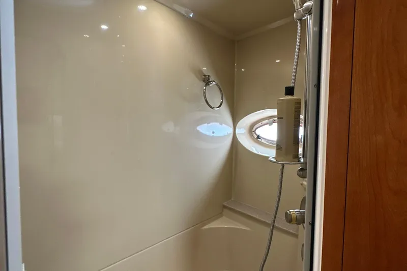 Slide: The Image of Shower area in 2004 Cruisers Yachts 405 Express Motoryacht with porthole and modern fixtures. - 78