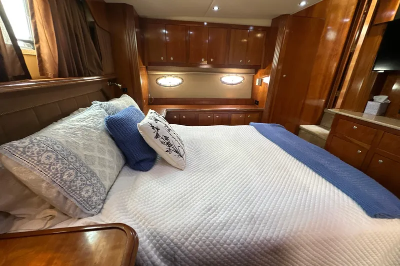 Slide: The Image of Luxurious bedroom interior of 2004 Cruisers Yachts 405 Express Motoryacht with elegant wood finish. - 88