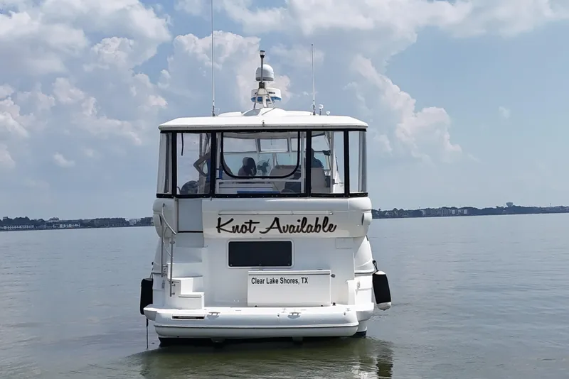 Slide: The Image of 2004 Cruisers Yachts 405 Express Motoryacht on calm water, rear view, Clear Lake Shores, TX. - 17