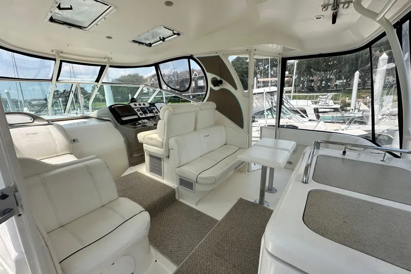 Slide: The Image of Luxurious interior of 2004 Cruisers Yachts 405 Express Motoryacht with plush seating and helm. - 22