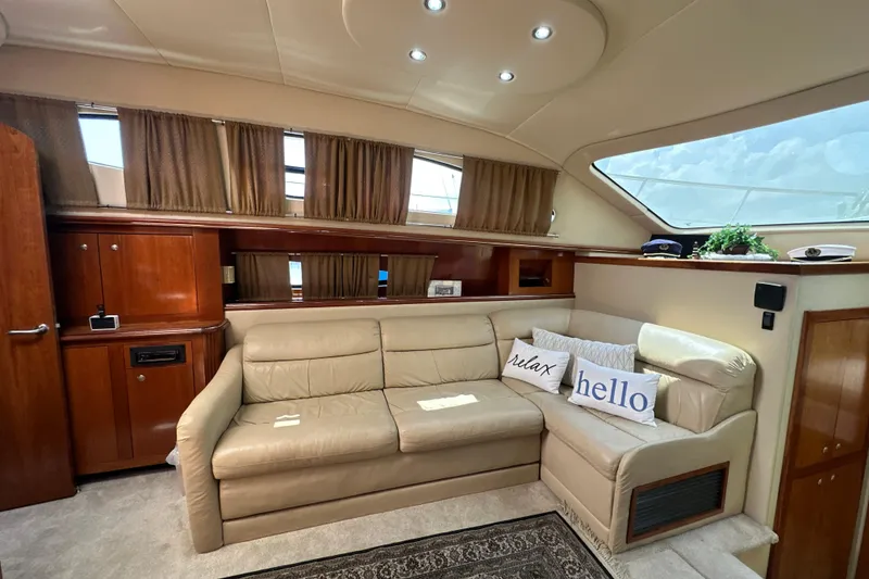 Slide: The Image of Luxurious 2004 Cruisers Yachts 405 Express Motoryacht interior with beige leather seating. - 61