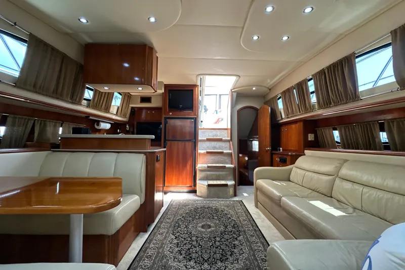 Slide: The Image of Luxurious interior of 2004 Cruisers Yachts 405 Express Motoryacht with elegant seating and wood finishes. - 63