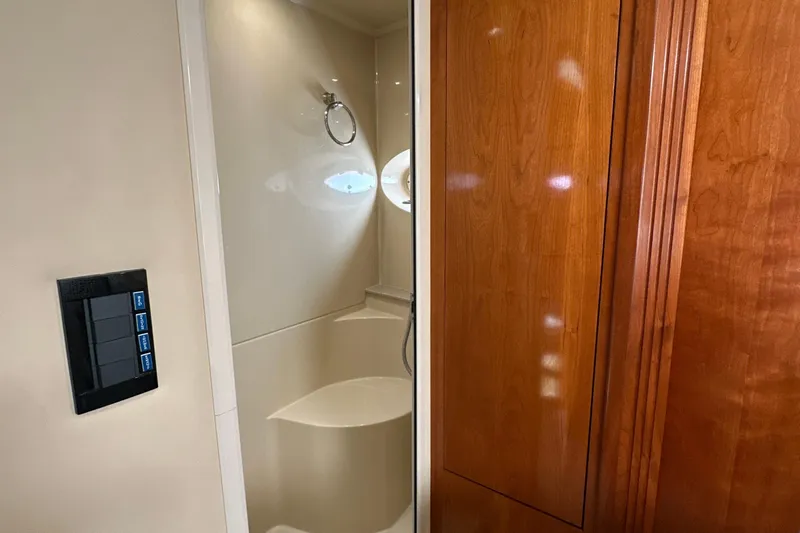 Slide: The Image of Luxurious bathroom interior of 2004 Cruisers Yachts 405 Express Motoryacht with wooden cabinetry. - 73