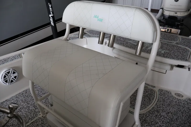 Slide: The Image of 2019 SeaVee 270Z boat interior with cushioned seating and rod holders. - 11