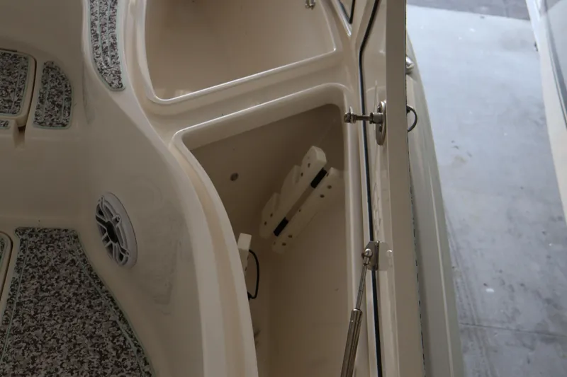 Slide: The Image of 2019 SeaVee 270Z boat storage compartment with open hatch and speaker. - 15