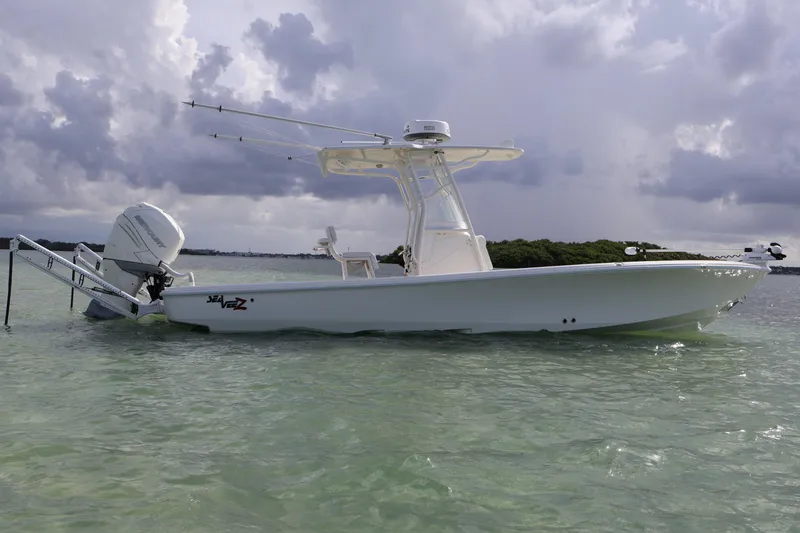 Slide: The Image of 2019 SeaVee 270Z boat in shallow water under cloudy skies. - 2