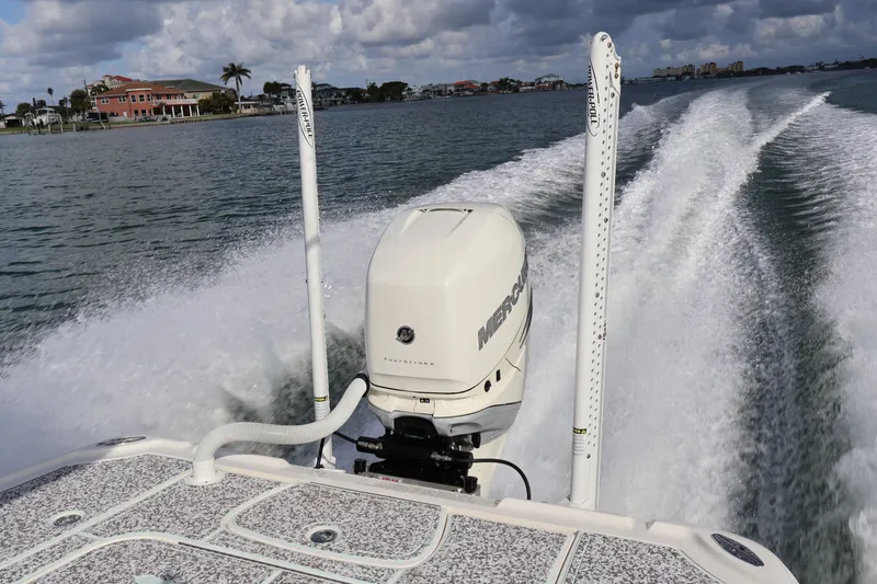 Slide: The Image of 2019 SeaVee 270Z boat with Mercury engine cruising on water, leaving a wake. - 20