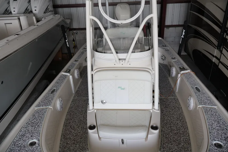 Slide: The Image of 2019 SeaVee 270Z boat in storage, showcasing sleek design and spacious deck. - 9