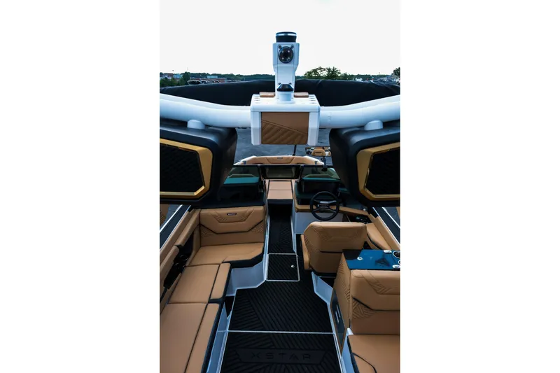 Slide: The Image of 2026 MasterCraft XStar 25 interior with luxurious tan seating and modern design elements. - 18